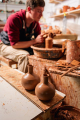 Potter at work. Workshop place.