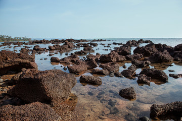 Fototapeta na wymiar Beautiful volcanic rocks along the beach in Koh Mak island, Trat province,Thailand
