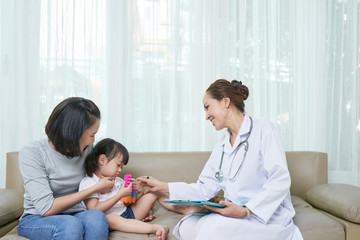 Fototapeta premium Pediatrician with little patient at hospital