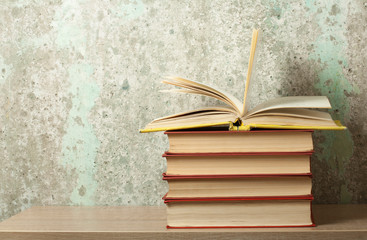 Open book, hardback books on wooden table. Education concept. Back to school. Copy space for text.