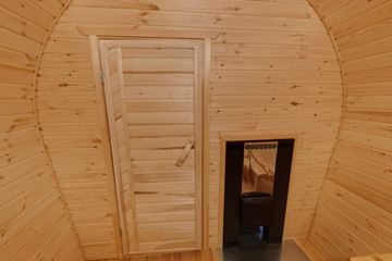 interior of  wooden bath in the form of a barrel. Rural mobile bath