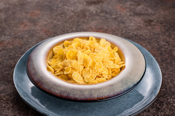 Cornflakes in a ceramic plate.