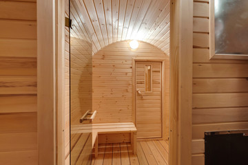 interior of  wooden bath in the form of a barrel. Rural mobile bath