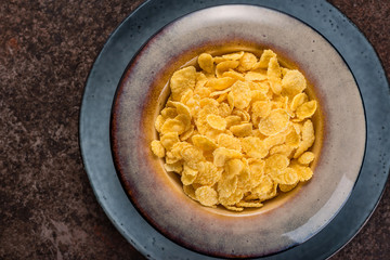 Cornflakes in a ceramic plate.