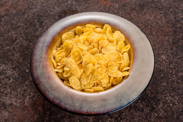 Cornflakes in a ceramic plate.