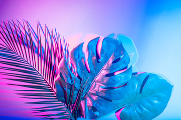 Tropical leaves in vibrant bold gradient holographic neon colors