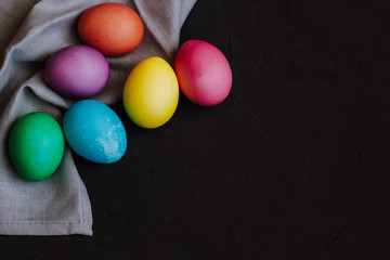 Fototapeta na wymiar Colored easter eggs on a black background