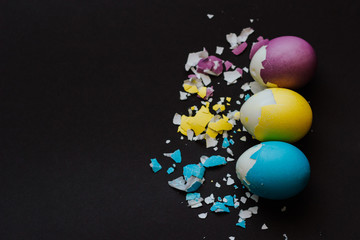 Colored easter eggs on a black background