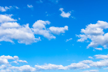 Naklejka na ściany i meble Background of beautiful blue sky and white clouds with sun light. 