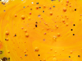 Pattern of multicolour spheres and hexagons on abstract background. Close up macro shot. Blurred background. Selective soft focus. Abstract orange universe. Colourful space of bubbles