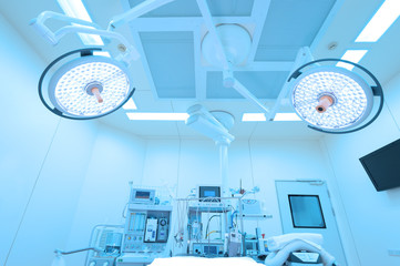 Equipment and medical devices in modern operating room take with art lighting and blue filter