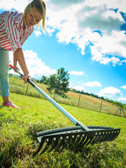 Woman raking leaves