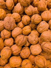 Natural walnut background pattern texture. Abstract walnuts heap pattern background.