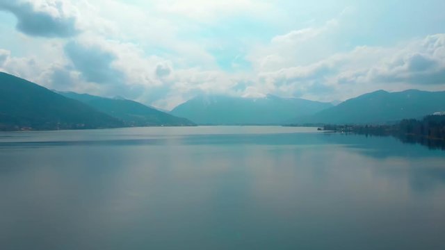 Ascending aerial shot, showing the Tegernsee in bavaria on a cloudy day, view towards Rottach Egern.