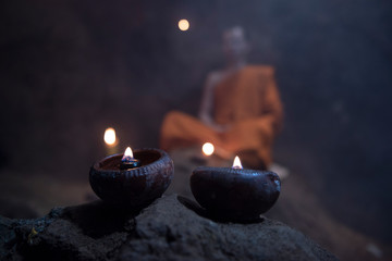 The meditation monk to follow the teachings of the Lord Buddha in the cave in Thailand.
