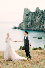 Awesome portrait of bride and groom hug each other tender