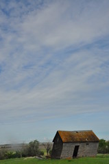 Weathered Barn Under Blue Sky