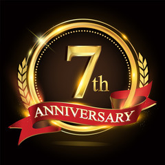 7th golden anniversary logo, with shiny ring and red ribbon, laurel wreath isolated on black background, vector design for birthday celebration.