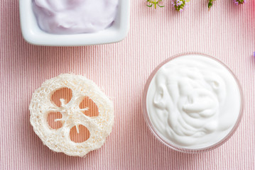 Creams on pink textile