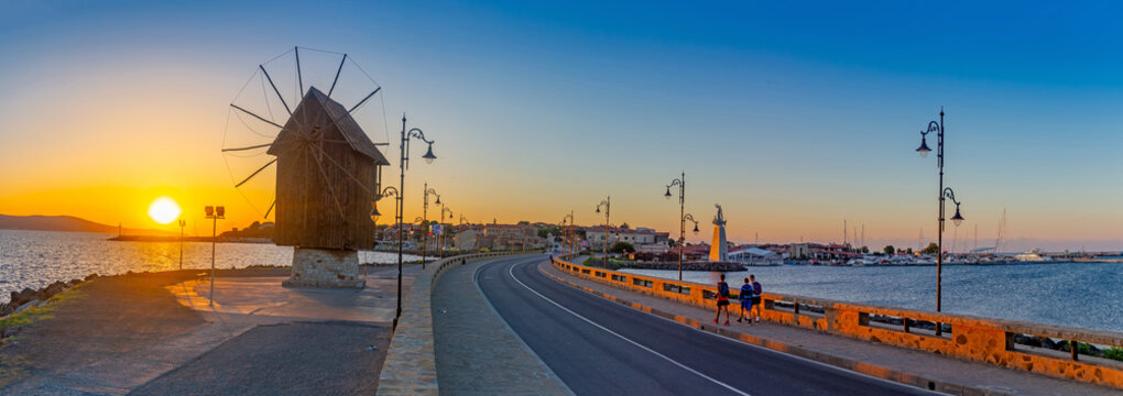 Nessebar, Bulgaria, 09 August 2018 - Old windmill at the entrance to the Old Town of Nessebar early in the morning on sunrise, ancient city on the Black Sea coast of Bulgaria.
