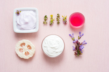 Creams on pink textile