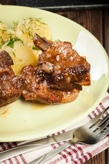 Pork spare ribs served with mashed potatoes and sauce