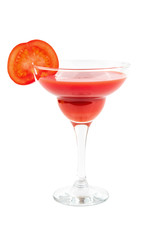 Tomato juice in a cocktail glass with a slice of tomato and parsley on a white isolated background