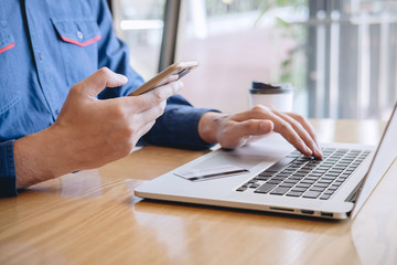 Businessman holding credit card and typing on laptop for online shopping and payment makes a purchase on the Internet, Online payment, Business financial and technology