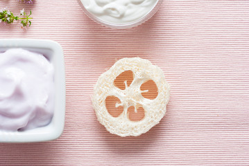 Creams on pink textile