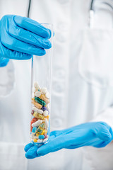 Pharmaceutical Research. Glass Test Tube Filled With Colorful Pills
