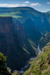 Landscape view of mountain valley with small river in Semonkong, Lesotho, Southern Africa