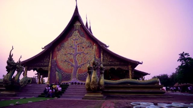 Thailand - Ubon Ratchathani: 10 April 2019: Thai people take family to visit Sirindhorn Wararam Phupha Temple (Wat Phu Phrao) in the evening near a very beautiful temple.
