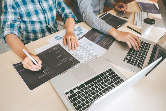 Team of Professional Developer programmer cooperation meeting and brainstorming and programming in website working a software and coding technology, writing codes and database