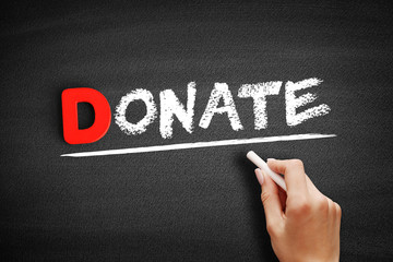 Donate text on blackboard, business concept background