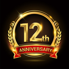 12th golden anniversary logo, with shiny ring and red ribbon, laurel wreath isolated on black background, vector design