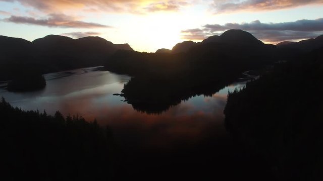 Aerial: Sunset Over Large Valley And Mountains in Mackenzie Sound, British Columbia