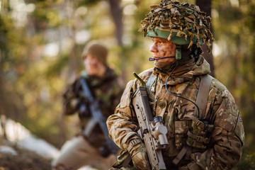 British special forces soldier with weapon take part in military maneuver. war, army, technology...
