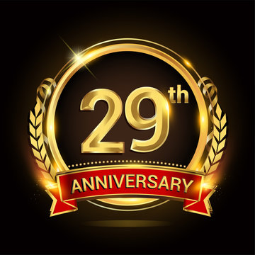 29th golden anniversary logo, with shiny ring and red ribbon, laurel wreath isolated on black background, vector design