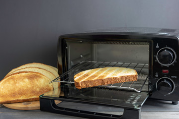 Electric micro oven with bread.