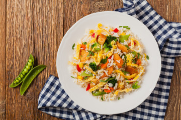 Nasi goreng. Fried rice with egg and vegetables.