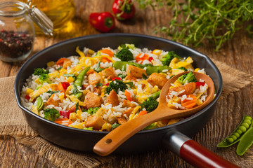 Nasi goreng. Fried rice with egg and vegetables.
