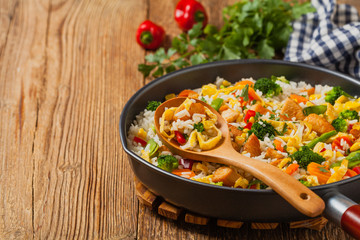 Nasi goreng. Fried rice with egg and vegetables.