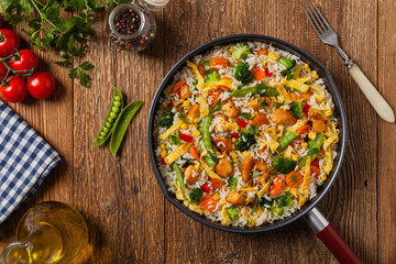 Nasi goreng. Fried rice with egg and vegetables.