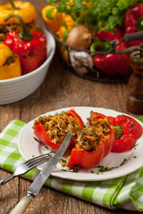 Colorful baked with cheese, stuffed peppers with rice and minced meat.