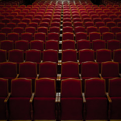 Empty comfortable red seats in a hall 