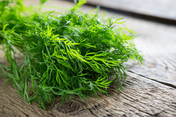 Fresh dill on a wooden table