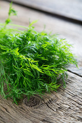 Fresh dill on a wooden table