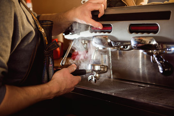 close up barista hand making a cup of coffee