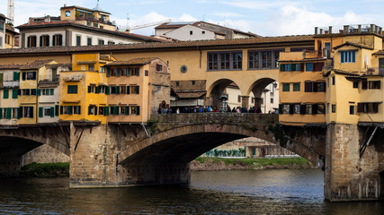 Fototapeta na wymiar Ponte Vecchio famous landmark bridge over the river in Firenze, Tuscany
