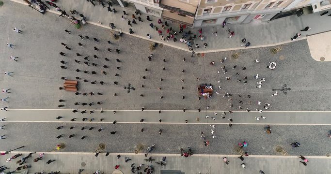 Aerial top down view: Flashmob performed by children in the central square. 4k. 50fps